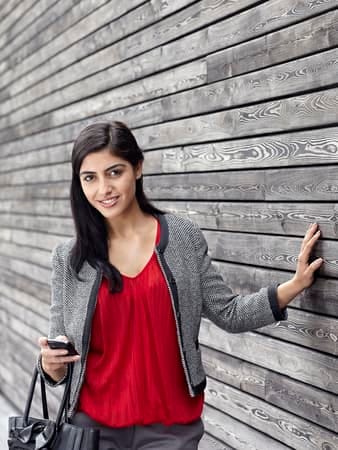 a young Indian woman posing outdoors