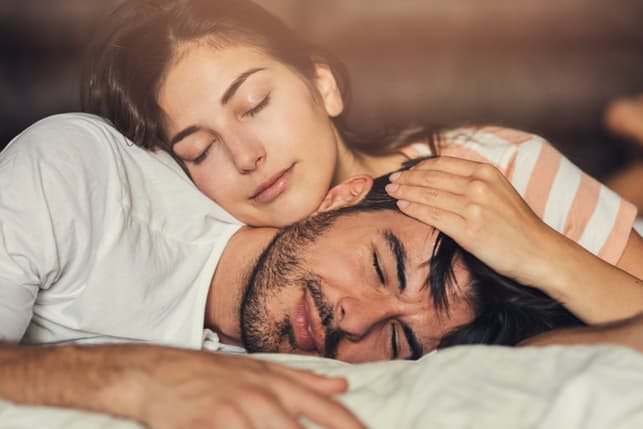 a couple sleeping together
