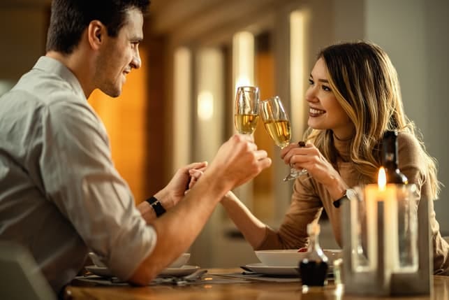 a couple drinking wine together on a date