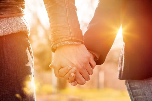 a couple holding hands on a date
