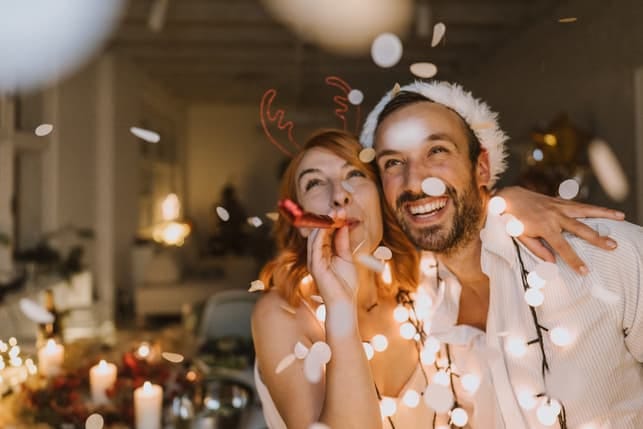a happy couple celebrating Christmas together