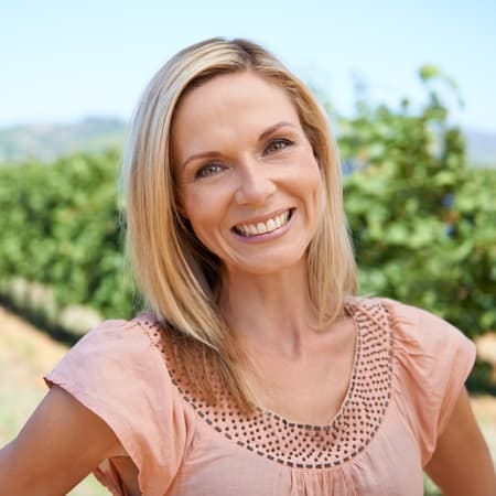a portrait of a blonde woman over 40