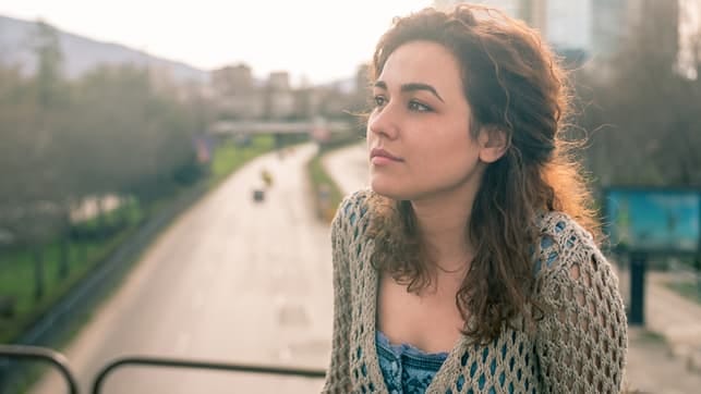 a portrait of a young curly woman