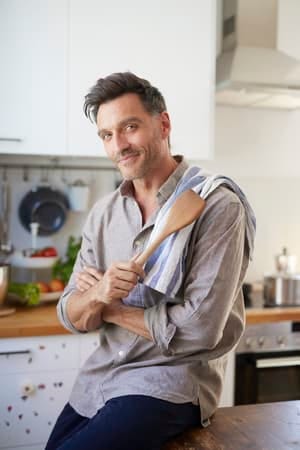 handsome man cooking at home