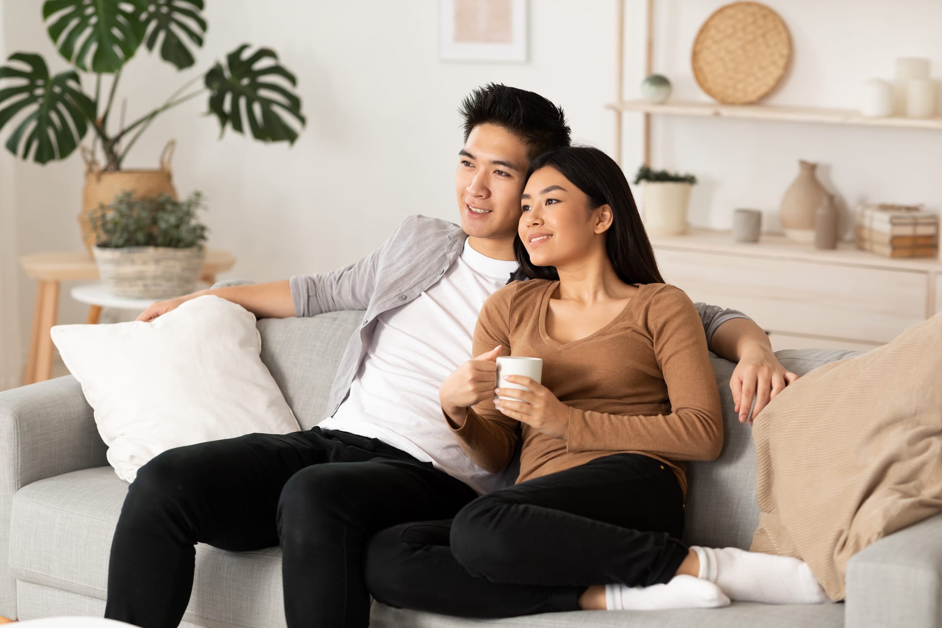 A couple watching a movie at home